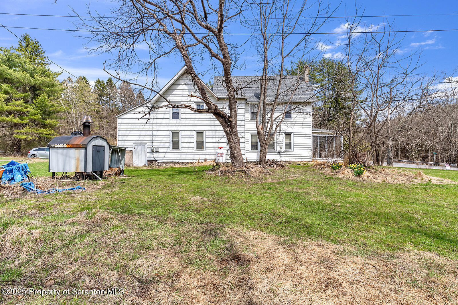 1079 Sutton Creek Road Dallas, PA 18612 - Photo 61 of 64 a view of a house with yard and tree s