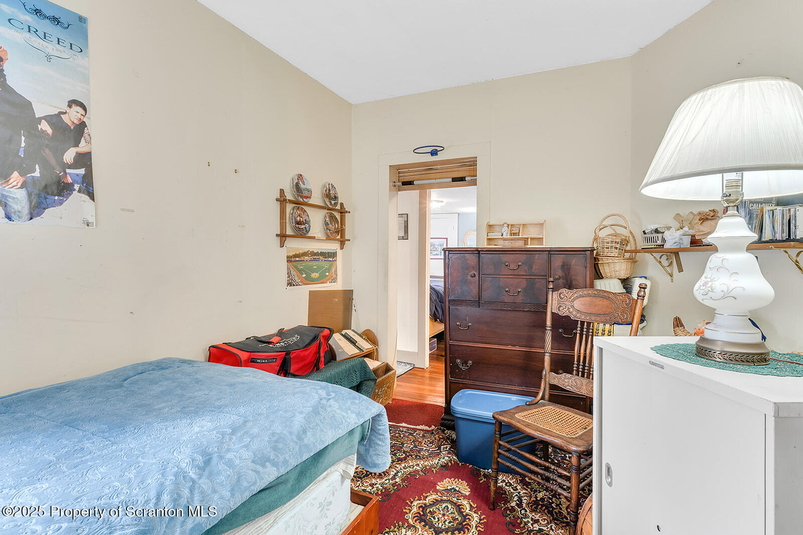 1079 Sutton Creek Road Dallas, PA 18612 - Photo 7 of 64 a bedroom with furniture and a lamp