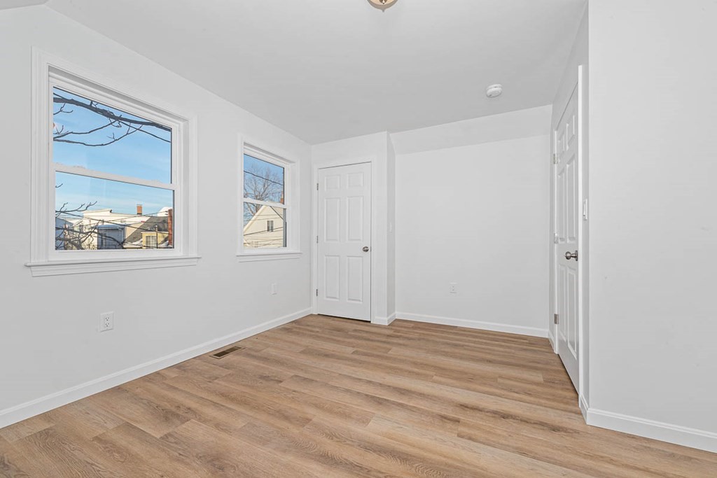 40 Everett Avenue Somerville, MA 02145 - Photo 21 of 21 a view of empty room with wooden floor