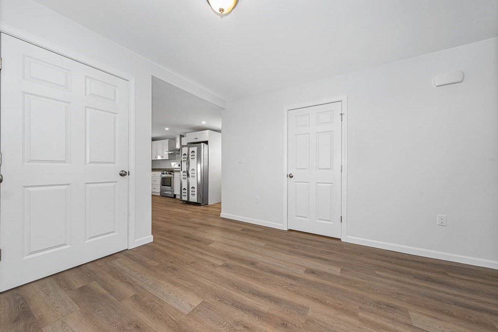 40 Everett Avenue Somerville, MA 02145 - Photo 10 of 21 a view of an empty room with wooden floor