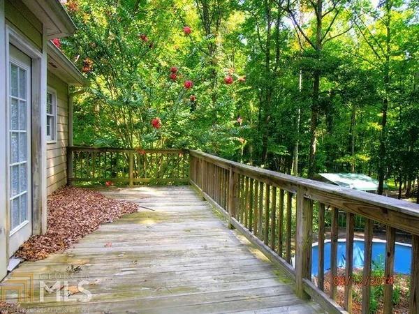 a view of a balcony with wooden floor