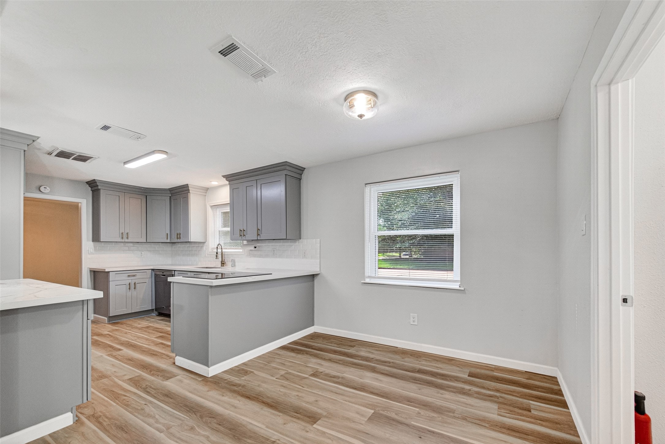 25503 Foxbriar Lane Spring, TX 77373 - Photo 15 of 45 a view of kitchen with wooden floor and electronic appliances