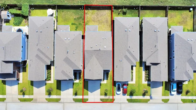 an aerial view of residential house with parking space