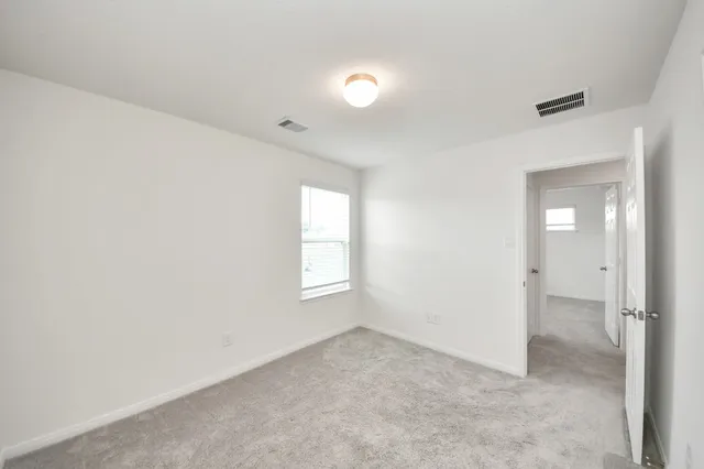 a bathroom with a bathtub a mirror a sink and a shower