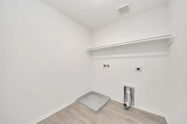 a view of house in front of a big yard with wooden fence