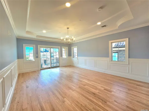 a spacious bathroom with a tub shower and sink