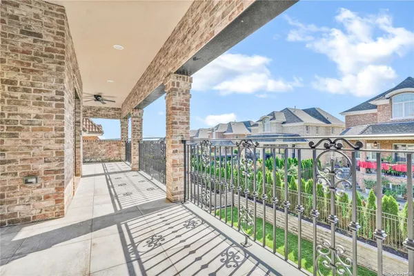 a view of a balcony with a floor to ceiling windows