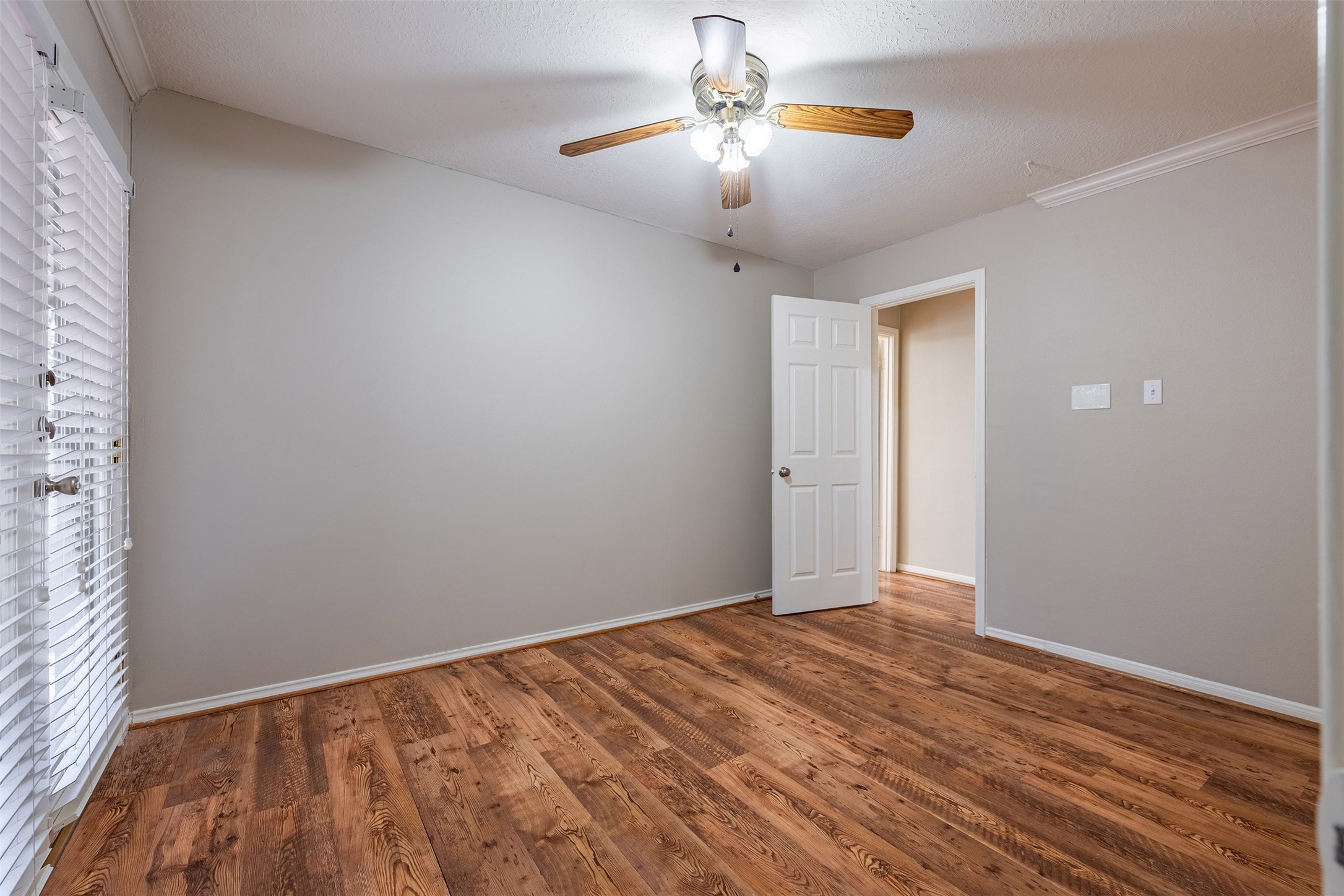 13623 Bonilla Lane Houston, TX 77083 - Photo 23 of 34 wooden floor in an empty room with a window