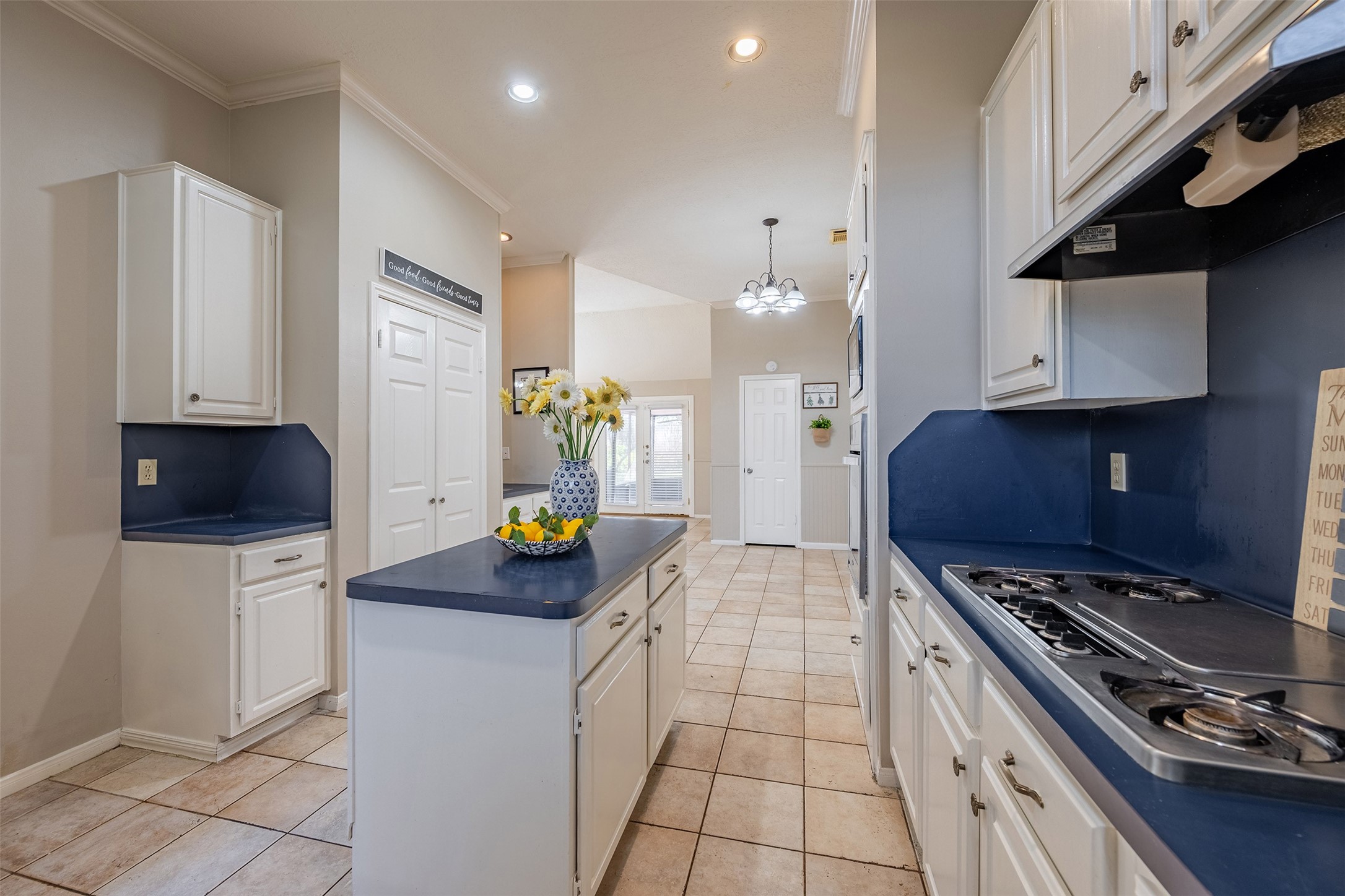 13623 Bonilla Lane Houston, TX 77083 - Photo 9 of 34 a kitchen with stainless steel appliances a stove a sink a refrigerator and a microwave
