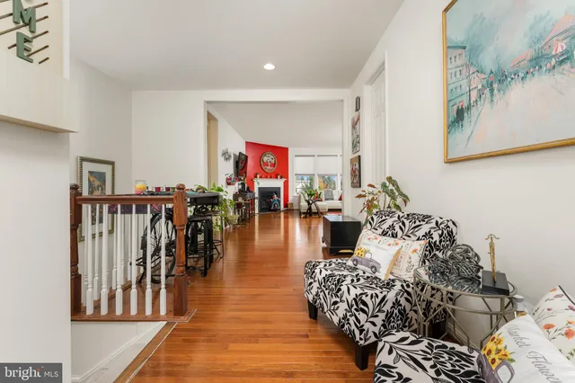 a living room with lots of furniture and a rug