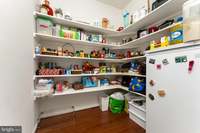 a room with a book shelf and a shelf