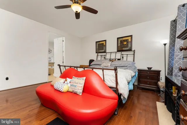 a bedroom with a bed and a couch