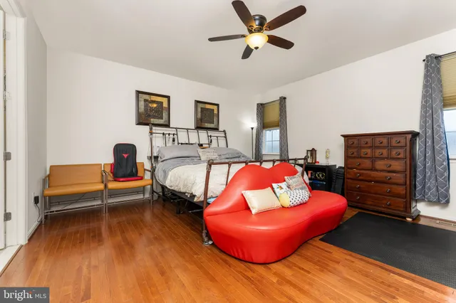 a bedroom with a bed and a couch