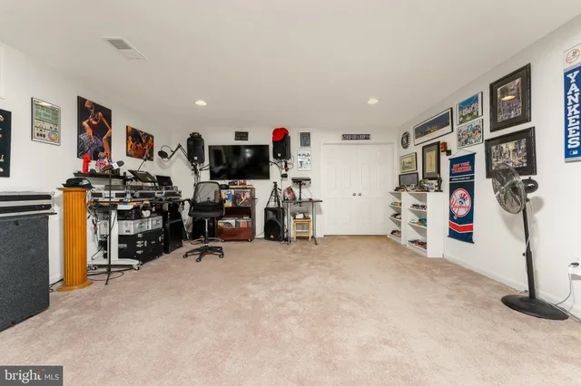 a view of a livingroom with workspace and a couch