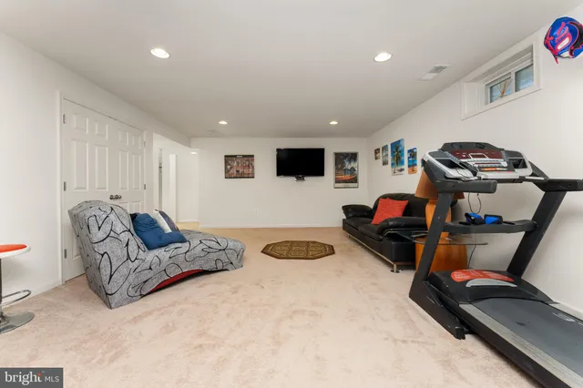 a bedroom with furniture and a flat screen tv