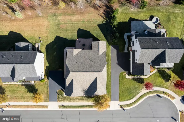 an aerial view of a house with a swimming pool