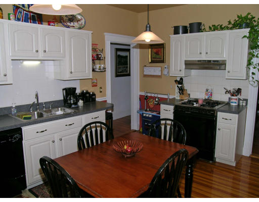 28 Parkton Road, Unit 2 Boston, MA 02130 - Photo 4 of 14 a kitchen with stainless steel appliances granite countertop a stove a sink a refrigerator and white cabinets