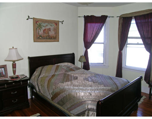 28 Parkton Road, Unit 2 Boston, MA 02130 - Photo 7 of 14 a bedroom with a bed and a window