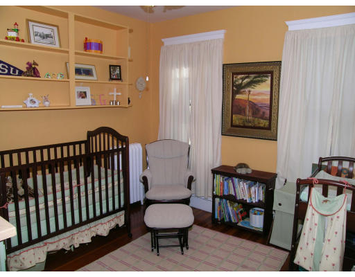 28 Parkton Road, Unit 2 Boston, MA 02130 - Photo 8 of 14 a living room with furniture and a toilet