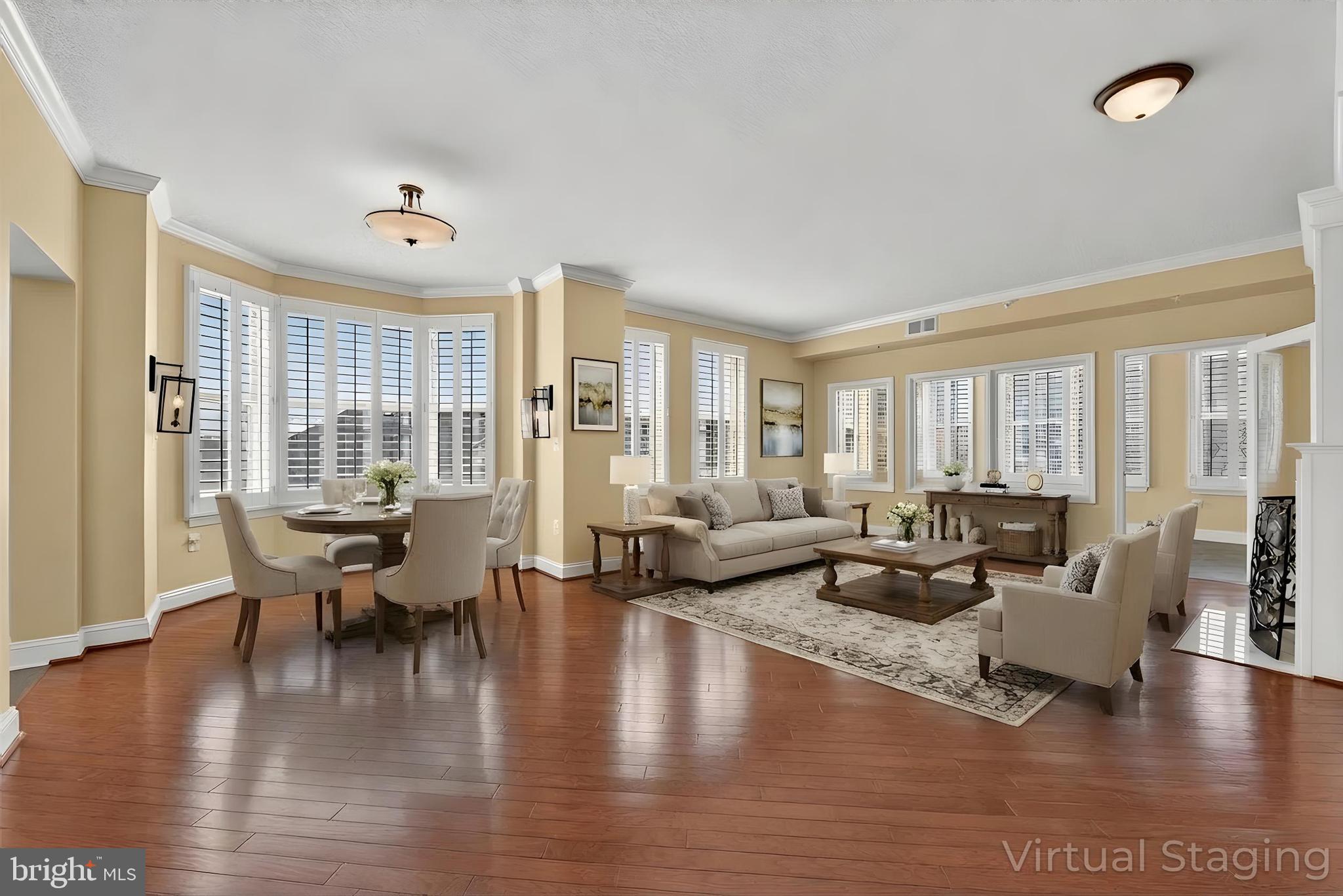 11776 Stratford House Place, Unit 502 Reston, VA 20190 - Photo 1 of 35 a living room with couches and kitchen view with wooden floor