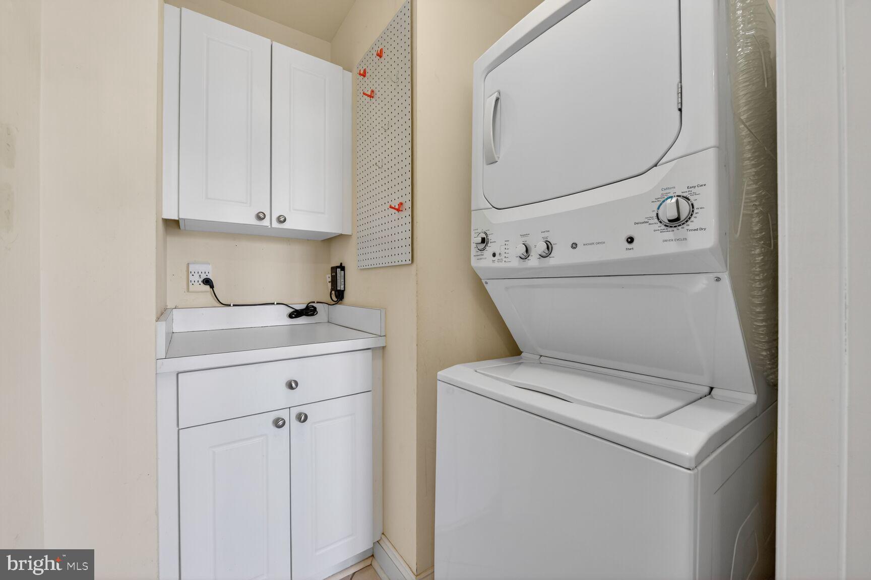 11776 Stratford House Place, Unit 502 Reston, VA 20190 - Photo 22 of 35 a utility room with dryer and washer