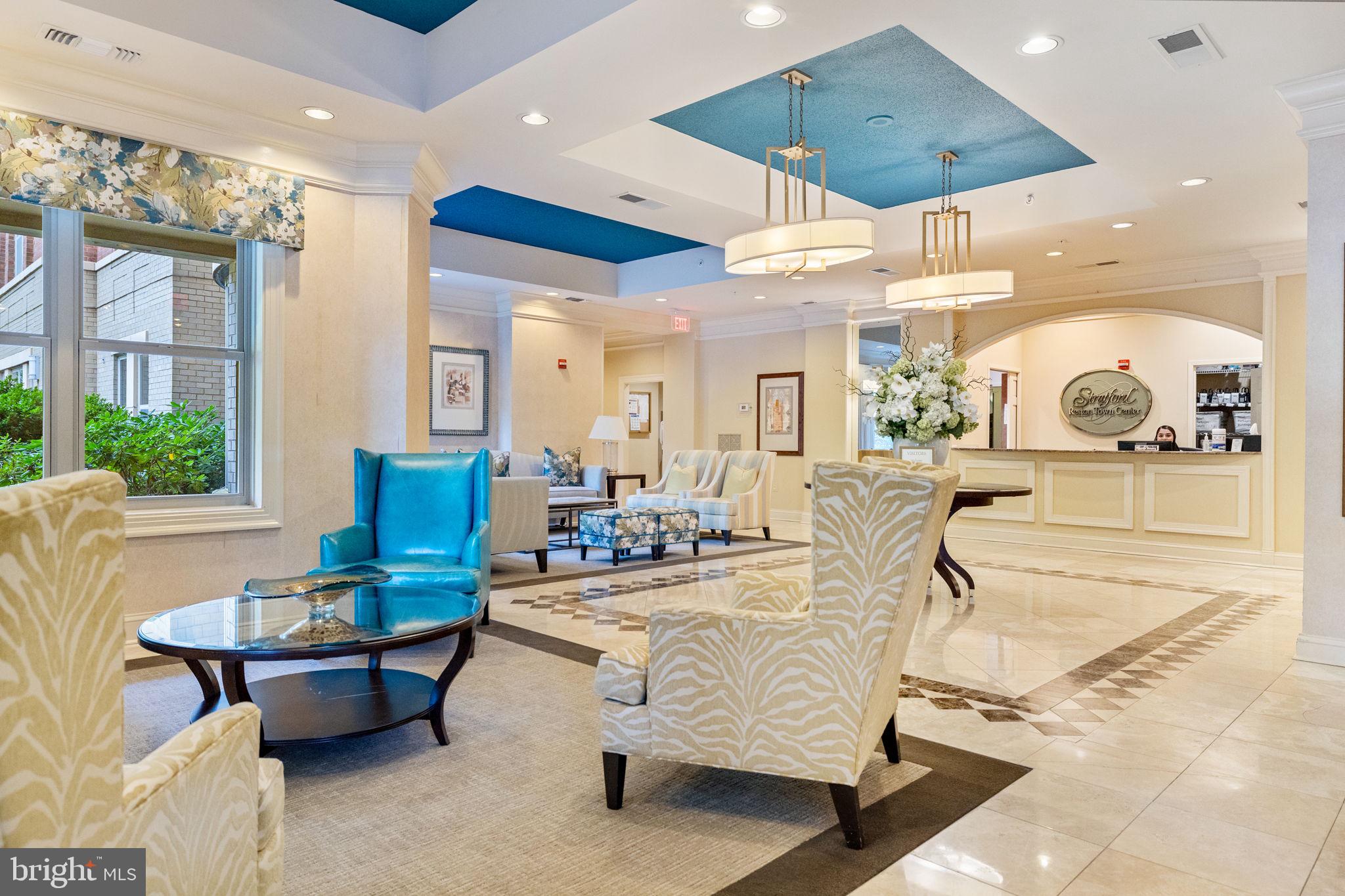 11776 Stratford House Place, Unit 502 Reston, VA 20190 - Photo 26 of 35 a living room with furniture kitchen view and a chandelier
