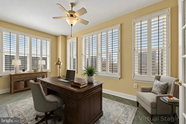 a living room with furniture and windows
