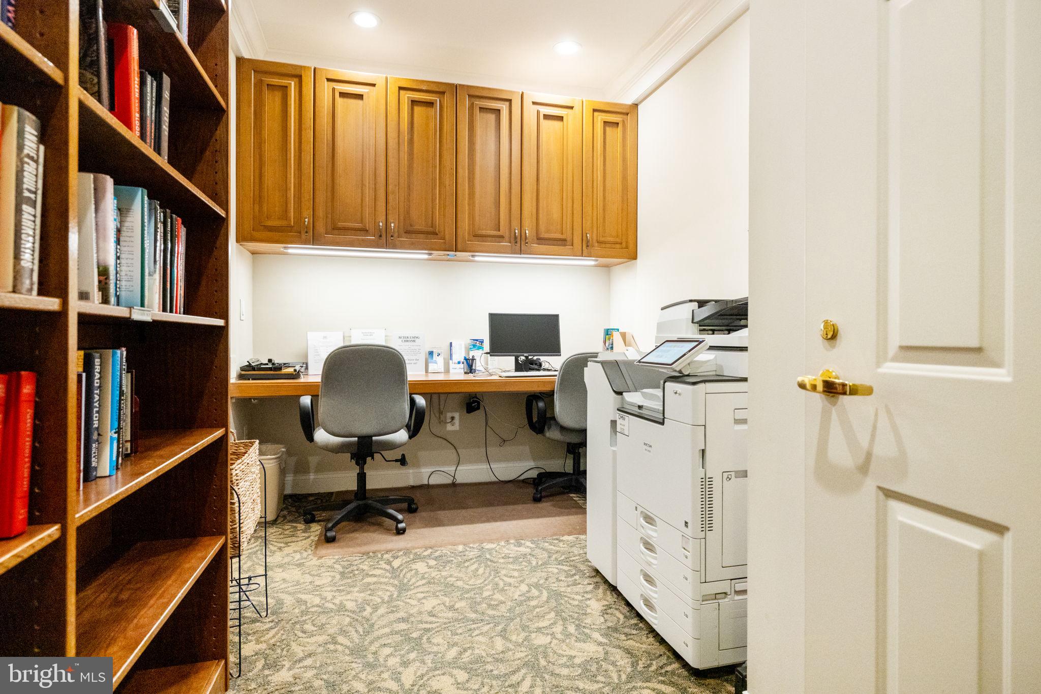 11776 Stratford House Place, Unit 502 Reston, VA 20190 - Photo 31 of 34 a view of a workspace with furniture and a window