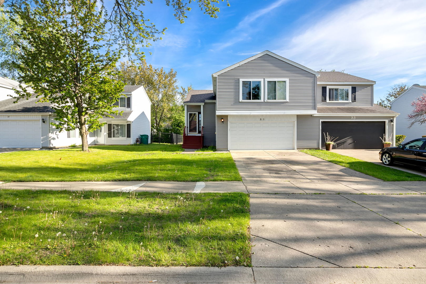 a front view of a house with a yard