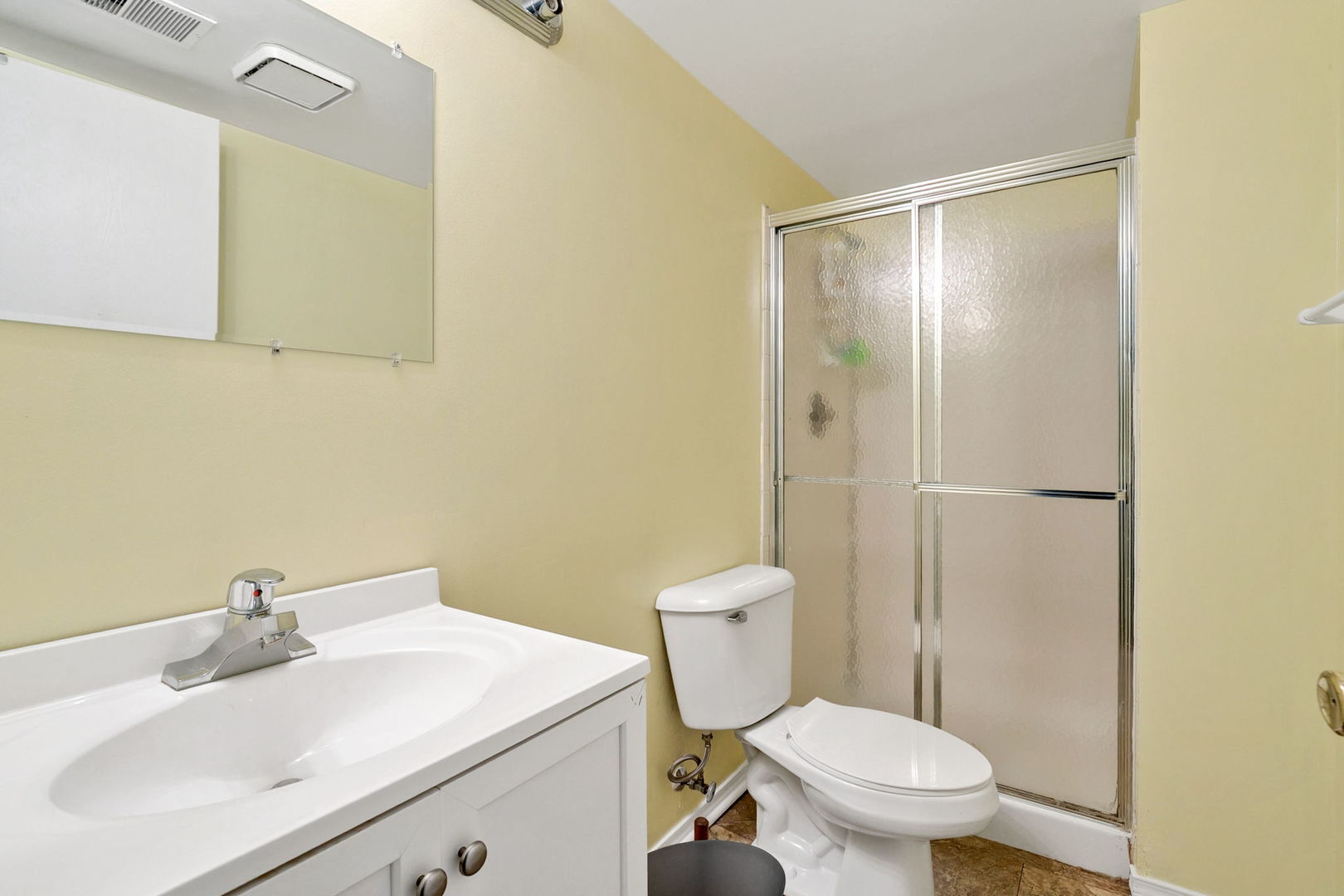 35 Buckingham Lane Buffalo Grove, IL 60089 - Photo 14 of 18 a bathroom with a sink a toilet and shower