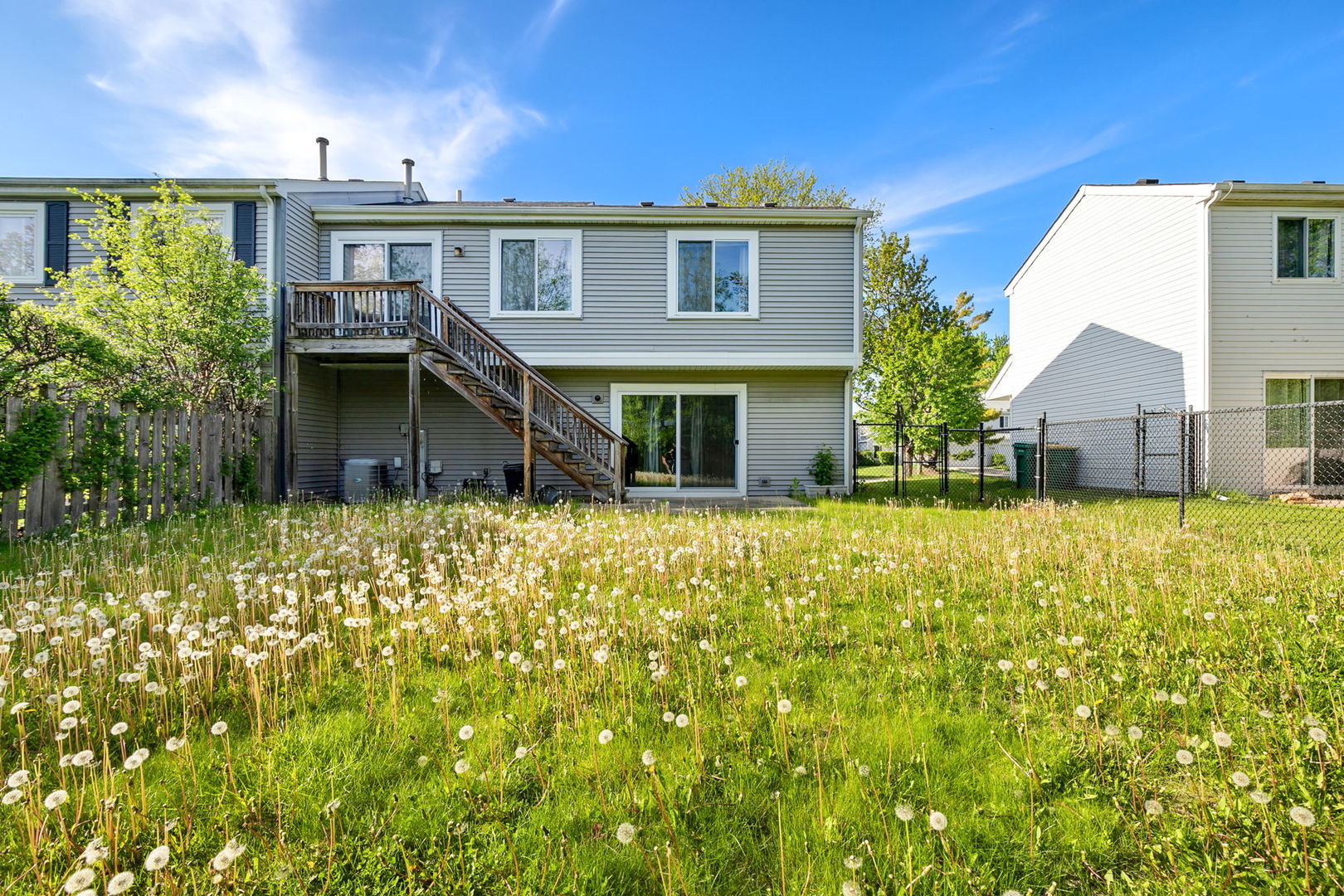 35 Buckingham Lane Buffalo Grove, IL 60089 - Photo 17 of 18 a front view of a house with a garden