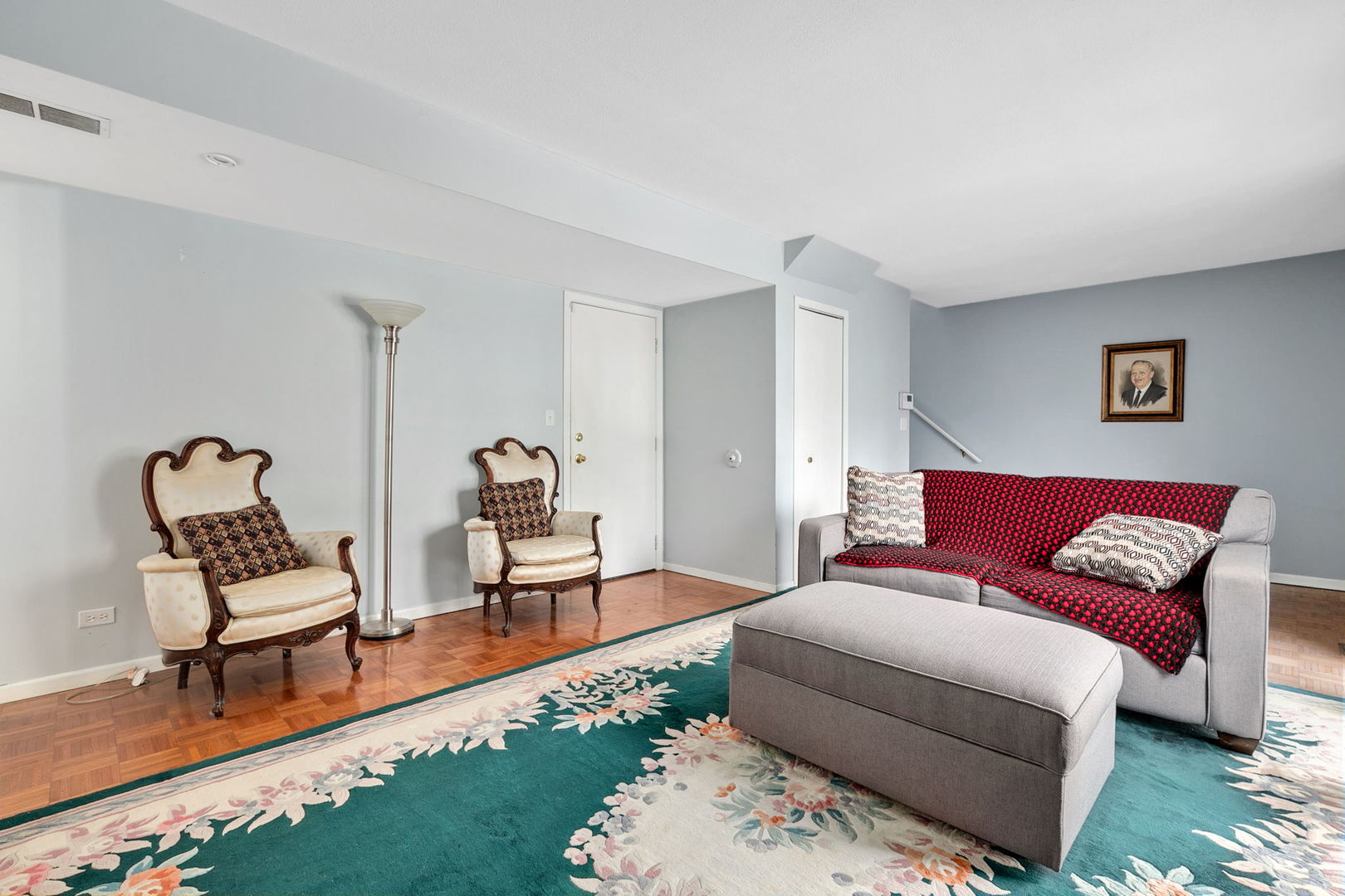 35 Buckingham Lane Buffalo Grove, IL 60089 - Photo 2 of 18 a living room with furniture and a rug