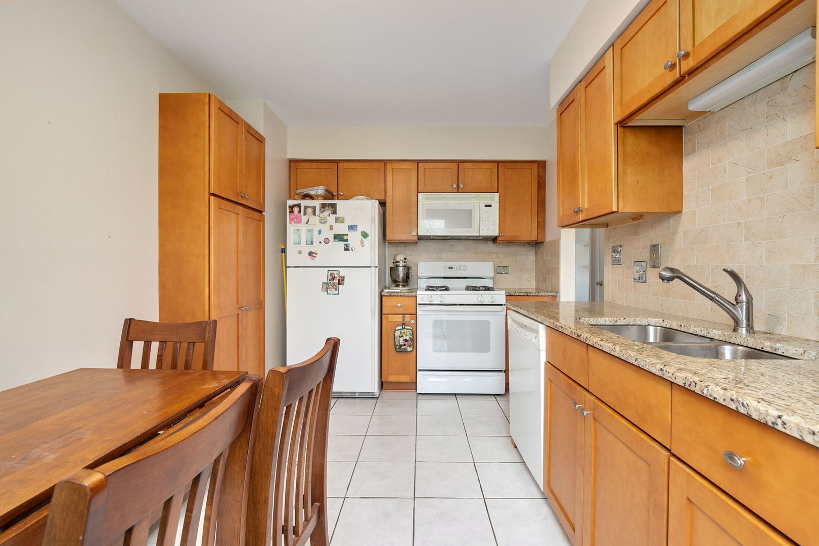 35 Buckingham Lane Buffalo Grove, IL 60089 - Photo 8 of 18 a kitchen with stainless steel appliances a stove refrigerator sink and cabinets