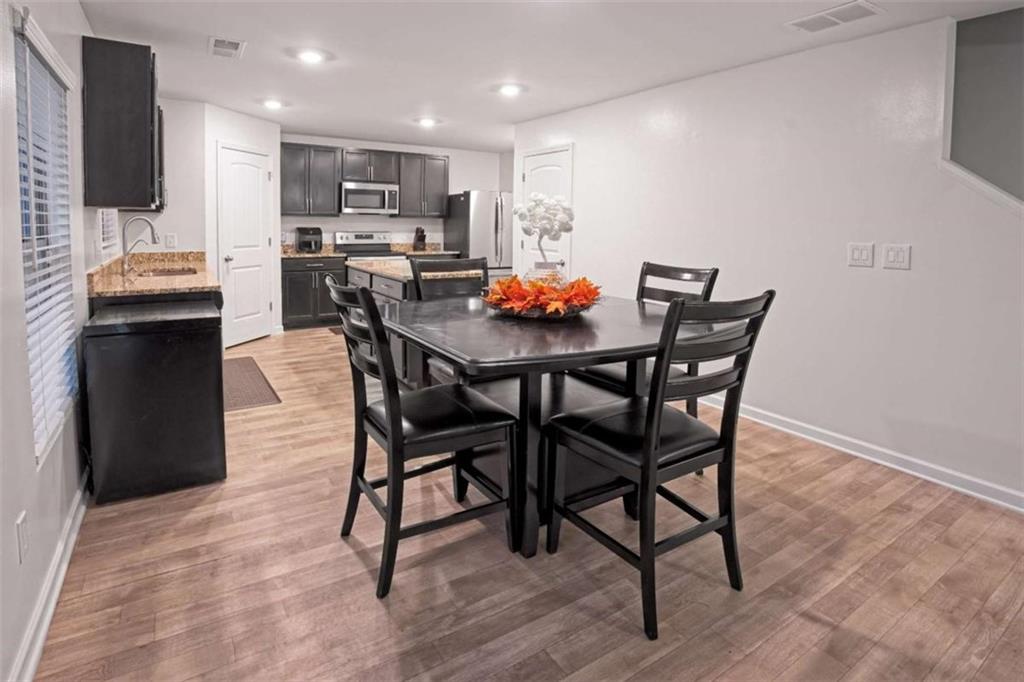 12001 Guelph Circle Hampton, GA 30228 - Photo 12 of 31 a view of a dining room with furniture
