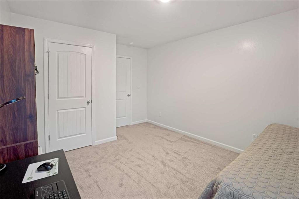 12001 Guelph Circle Hampton, GA 30228 - Photo 23 of 31 an empty room with a small space