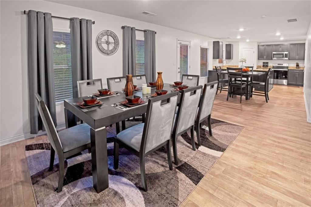 12001 Guelph Circle Hampton, GA 30228 - Photo 9 of 31 a view of a dining room with furniture