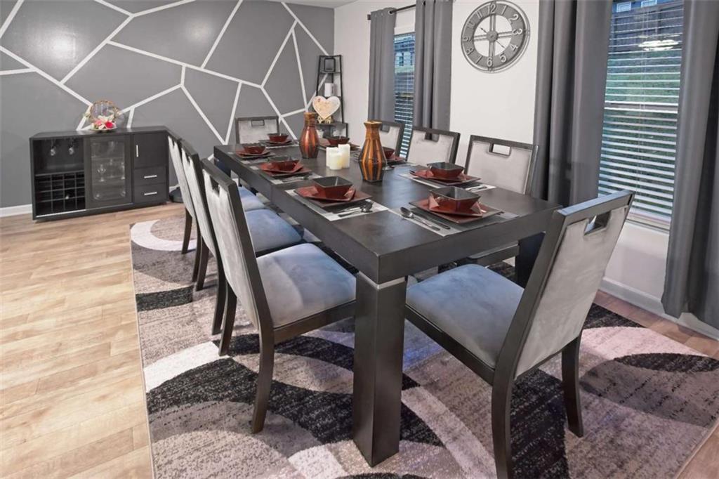 12001 Guelph Circle Hampton, GA 30228 - Photo 10 of 31 a view of a dining room with furniture