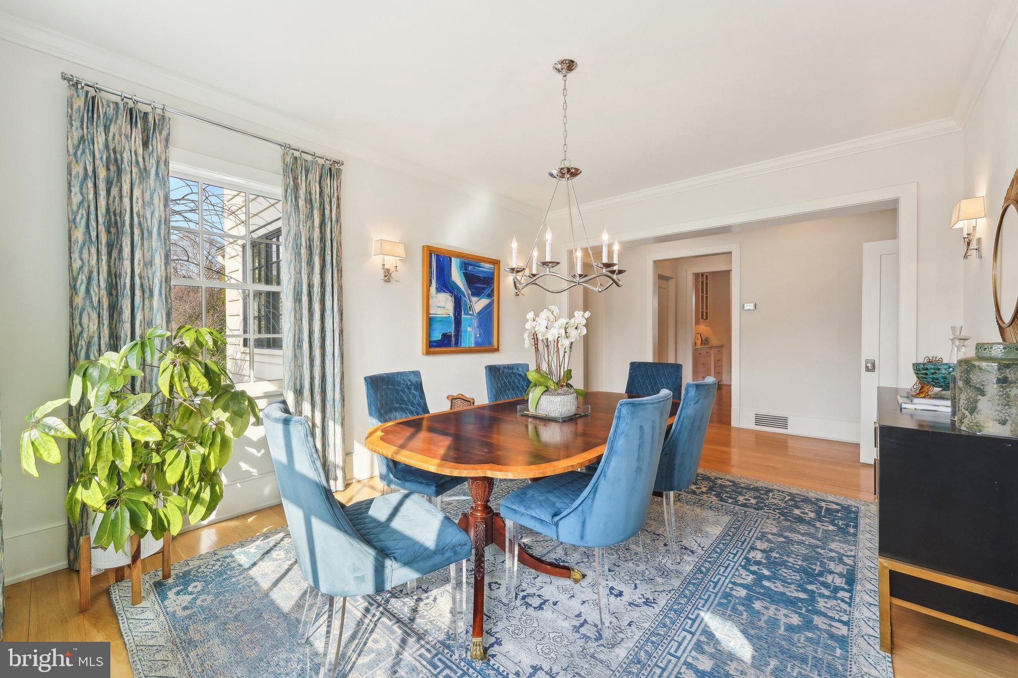 111 Steeplechase Road Devon, PA 19333 - Photo 12 of 77 a dining room with furniture a chandelier and wooden floor