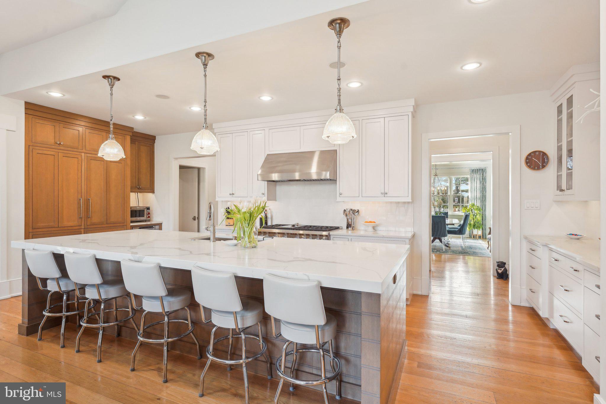 111 Steeplechase Road Devon, PA 19333 - Photo 15 of 77 a large kitchen with a table and chairs