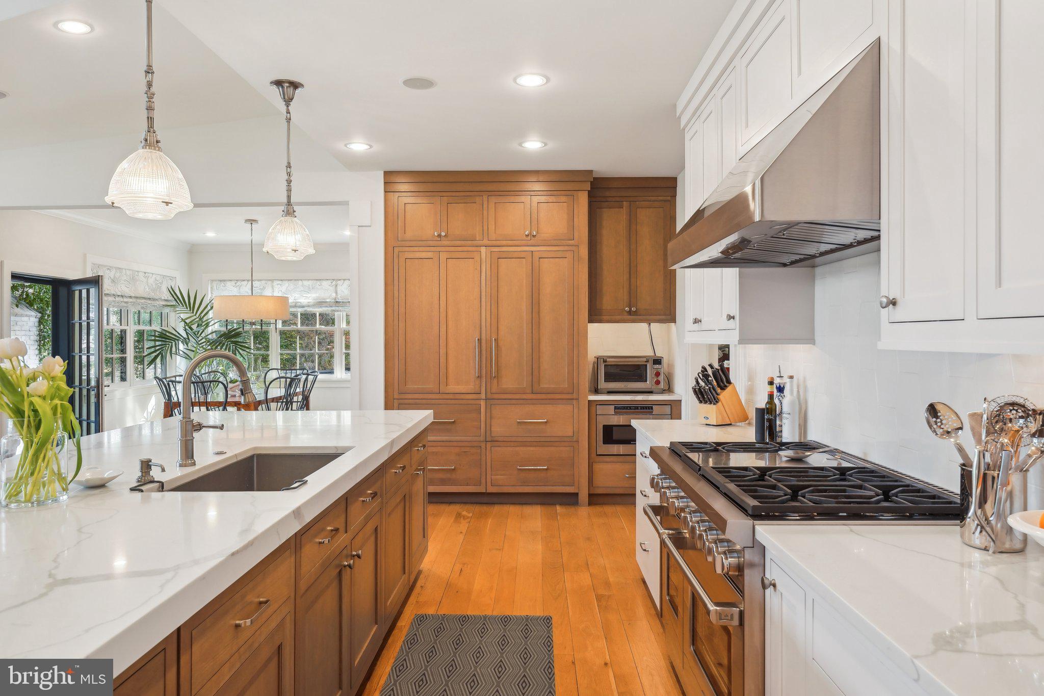 111 Steeplechase Road Devon, PA 19333 - Photo 17 of 77 a kitchen with granite countertop a sink a counter space appliances and cabinets