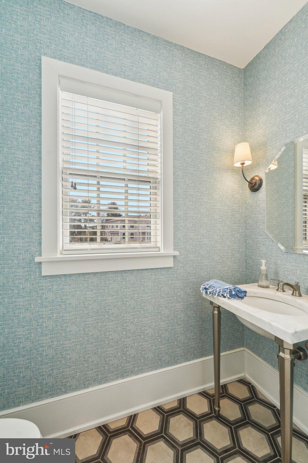 111 Steeplechase Road Devon, PA 19333 - Photo 35 of 77 a bathroom with a sink a vanity and a window