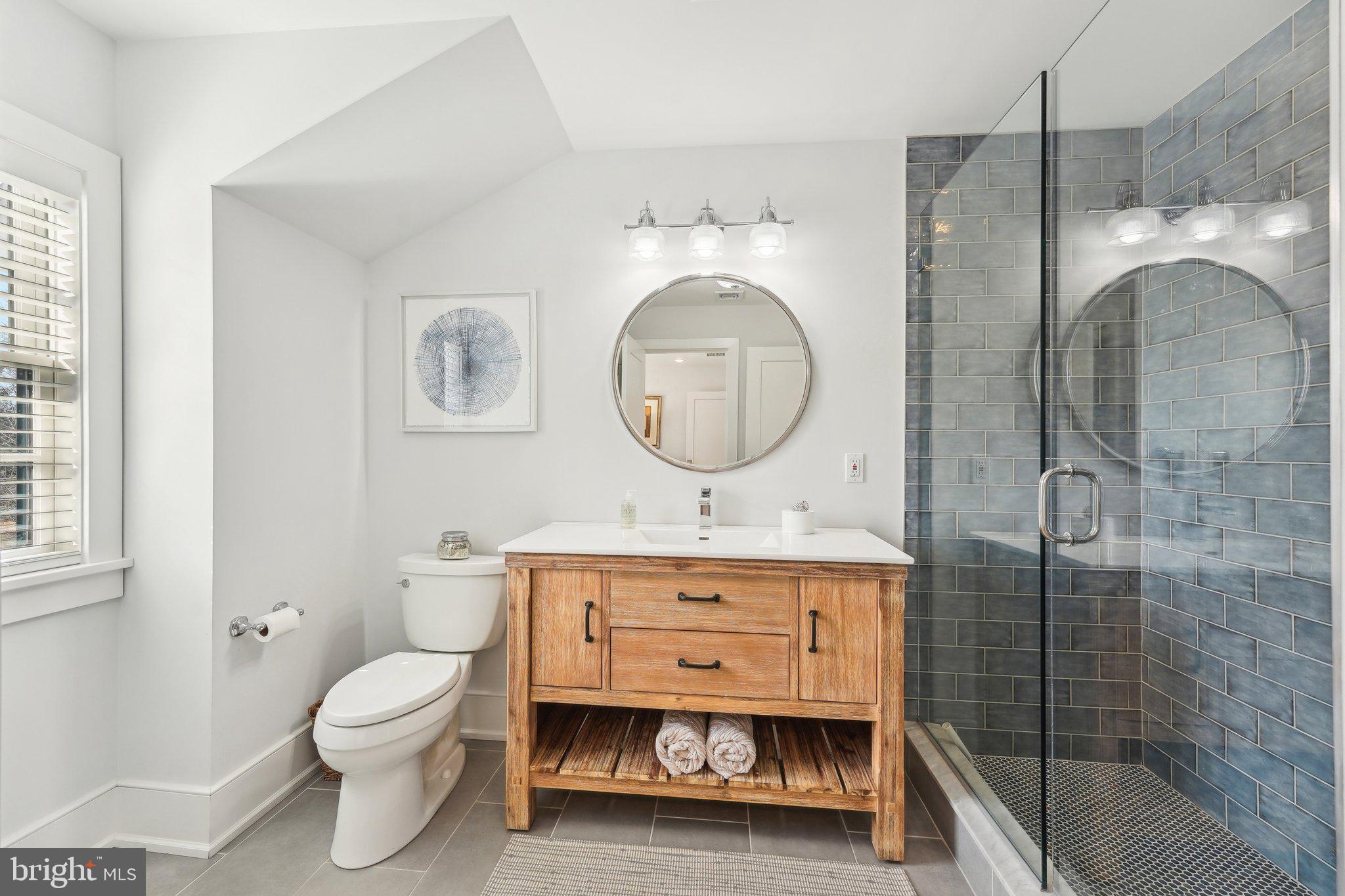 111 Steeplechase Road Devon, PA 19333 - Photo 46 of 77 a bathroom with a toilet a sink and shower
