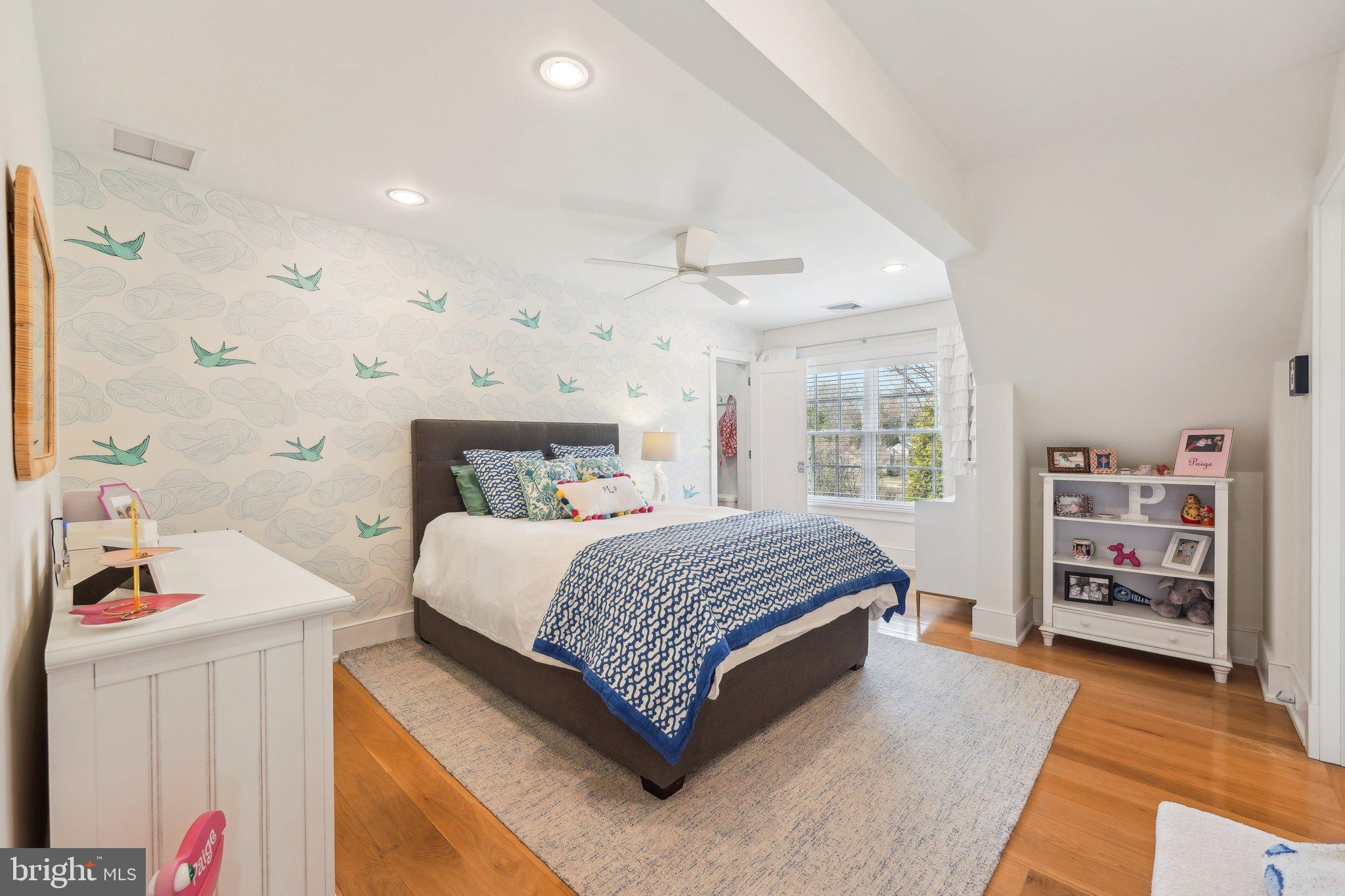 111 Steeplechase Road Devon, PA 19333 - Photo 49 of 77 a bedroom with a bed and a book shelf