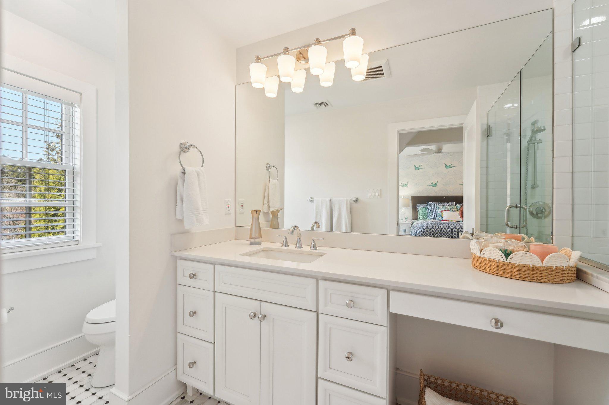 111 Steeplechase Road Devon, PA 19333 - Photo 51 of 77 a bathroom with a sink double vanity and a mirror