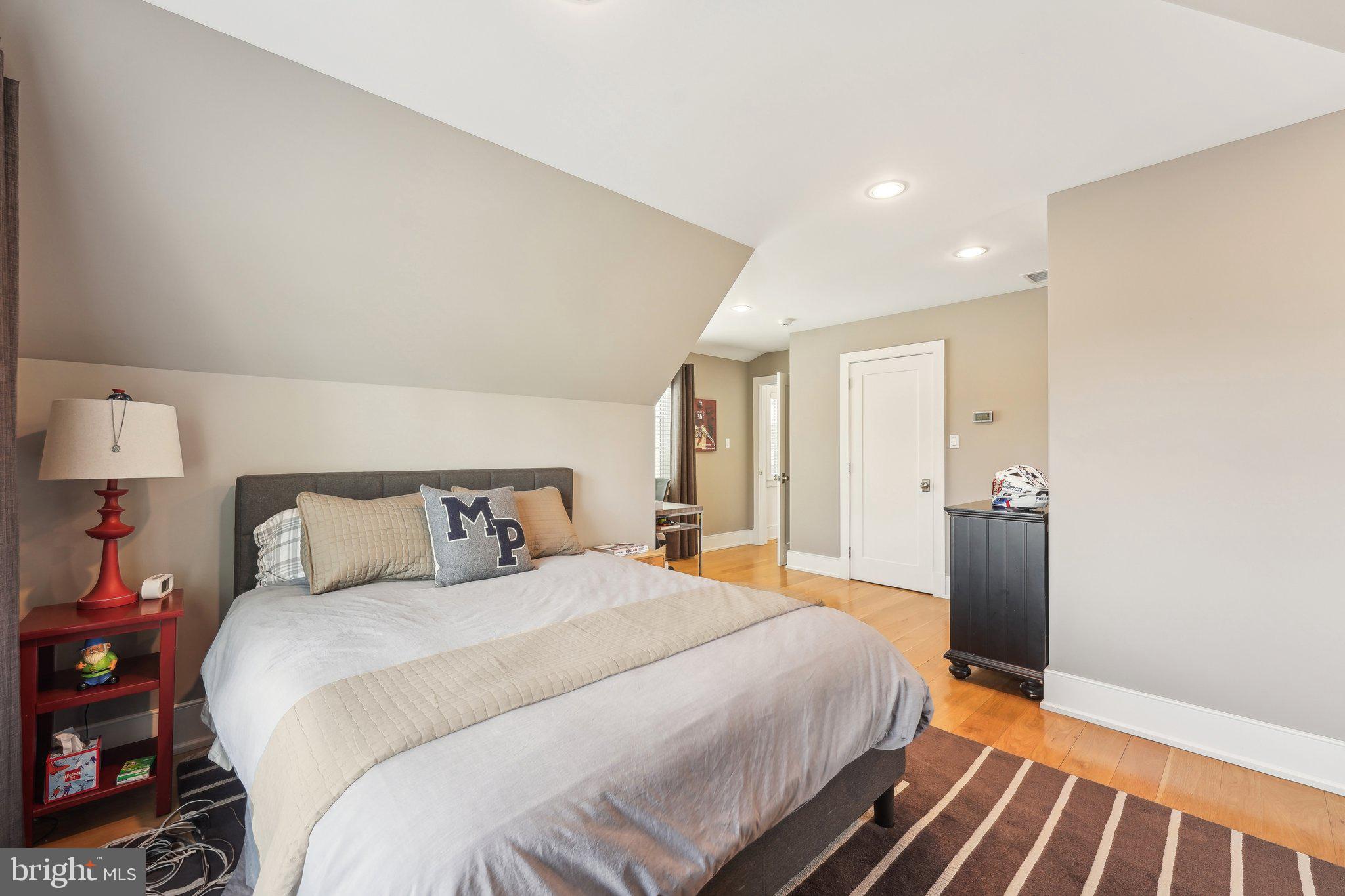 111 Steeplechase Road Devon, PA 19333 - Photo 52 of 77 a bedroom with a bed and a lamp