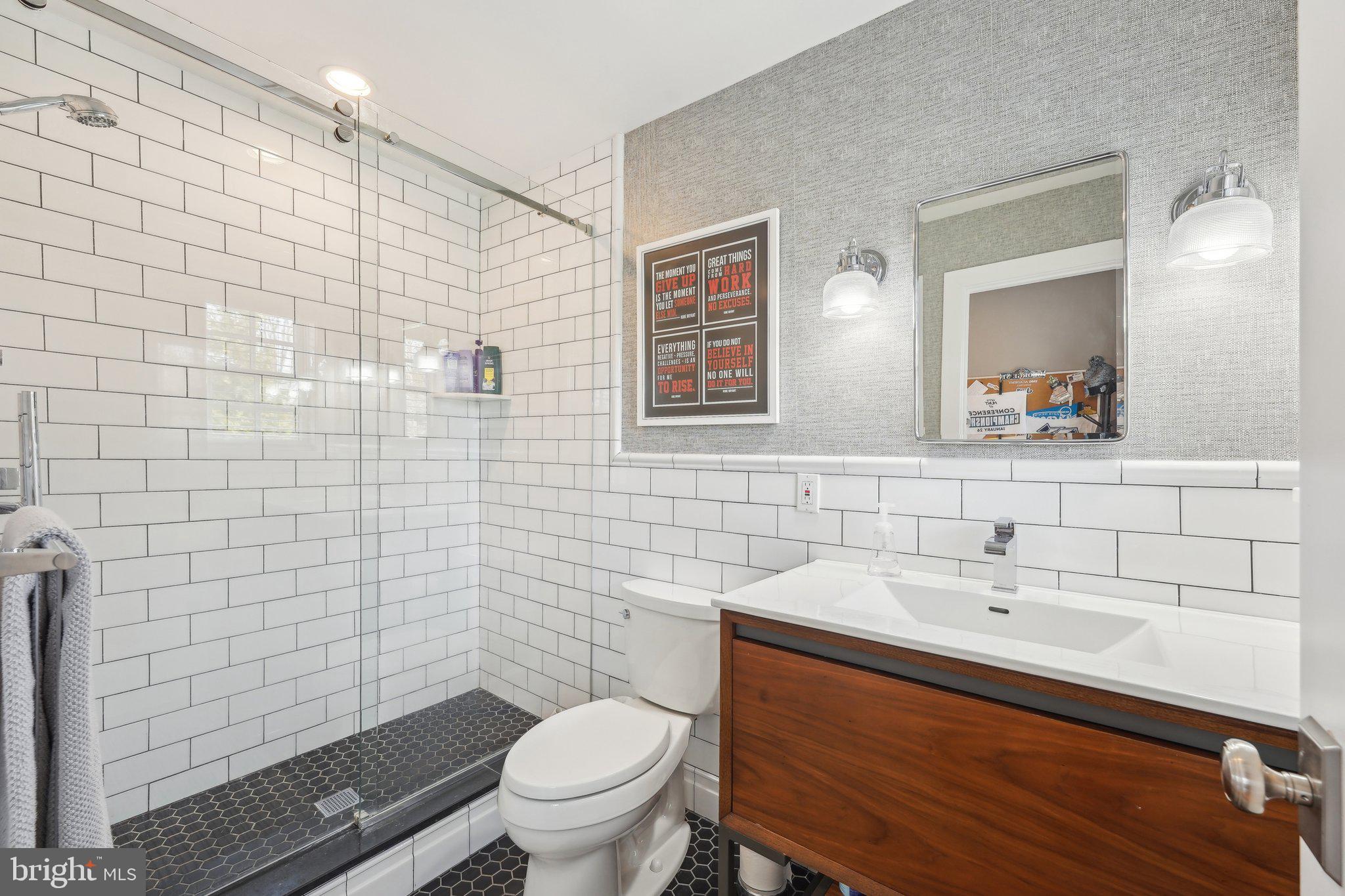 111 Steeplechase Road Devon, PA 19333 - Photo 55 of 77 a bathroom with a sink mirror vanity and toilet