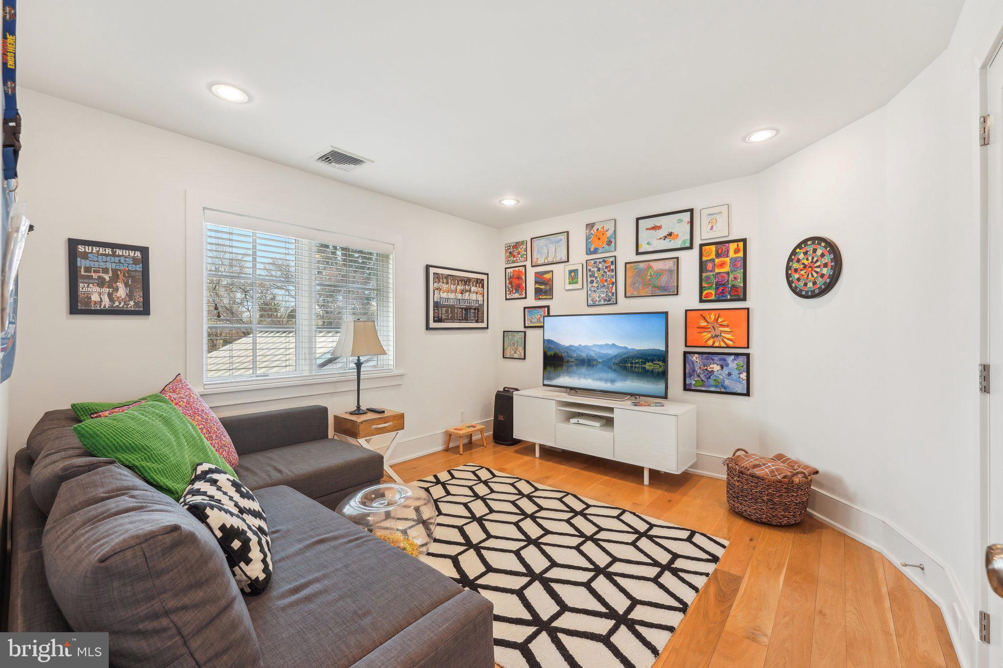 111 Steeplechase Road Devon, PA 19333 - Photo 56 of 77 a living room with furniture and a flat screen tv