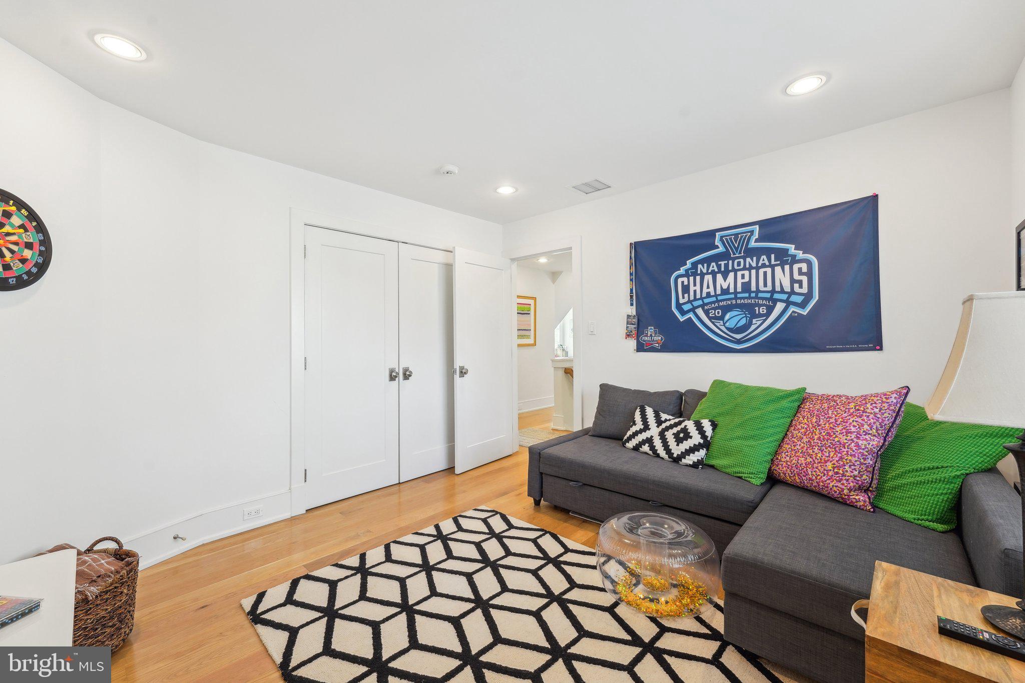 111 Steeplechase Road Devon, PA 19333 - Photo 57 of 77 a bedroom with a bed and a couch