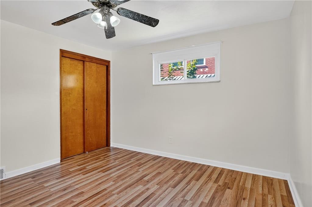 1209 Varner Road Pittsburgh, PA 15227 - Photo 18 of 40 a view of an empty room with wooden floor