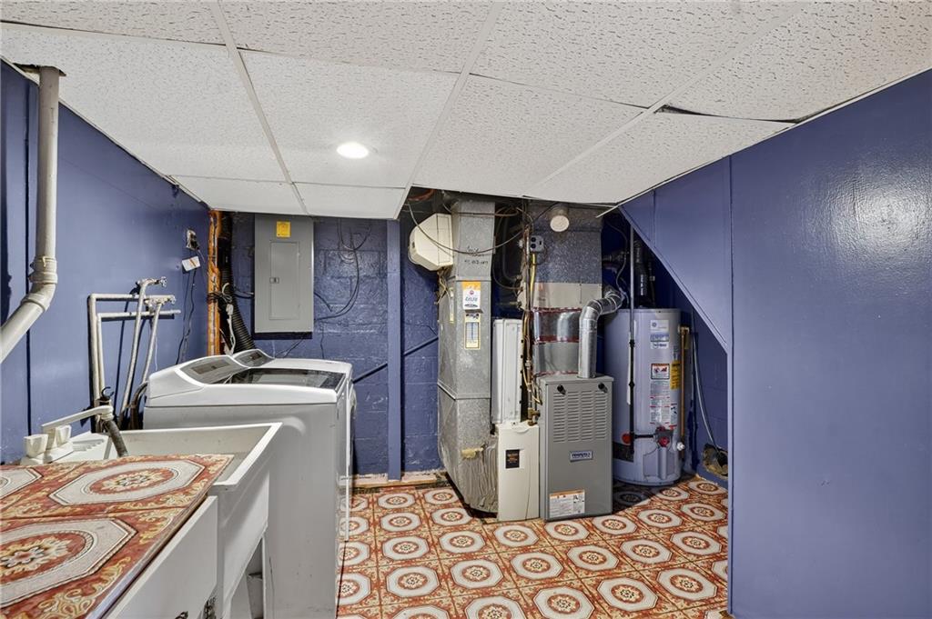 1209 Varner Road Pittsburgh, PA 15227 - Photo 27 of 40 a kitchen with sink cabinets and stainless steel appliances